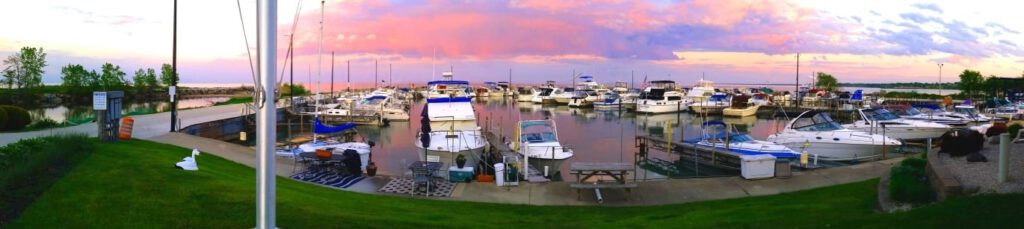 Panoramic view of a a beautiful Lake Michigan pink sunrise outside the South Milwaukee Yacht Club.